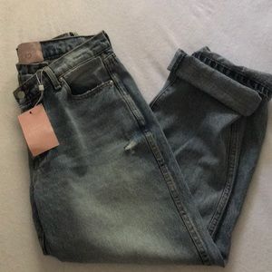 BRAND NEW W TAG medium wash asymmetrical jeans